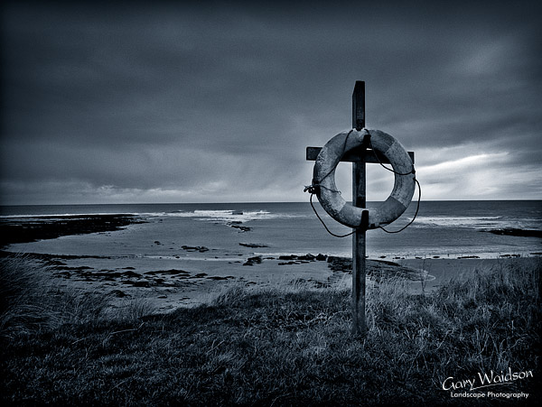 Life ring. Bamburgh. Northumberland. Landscape photography by Gary Waidson.