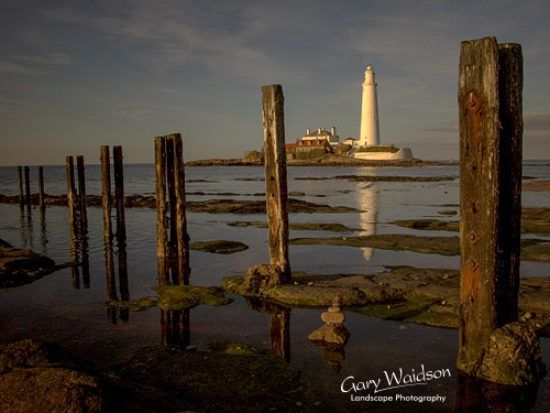 St. Mary's Island Lighthouse, posts and small stack. Landscape photography by Gary Waidson.